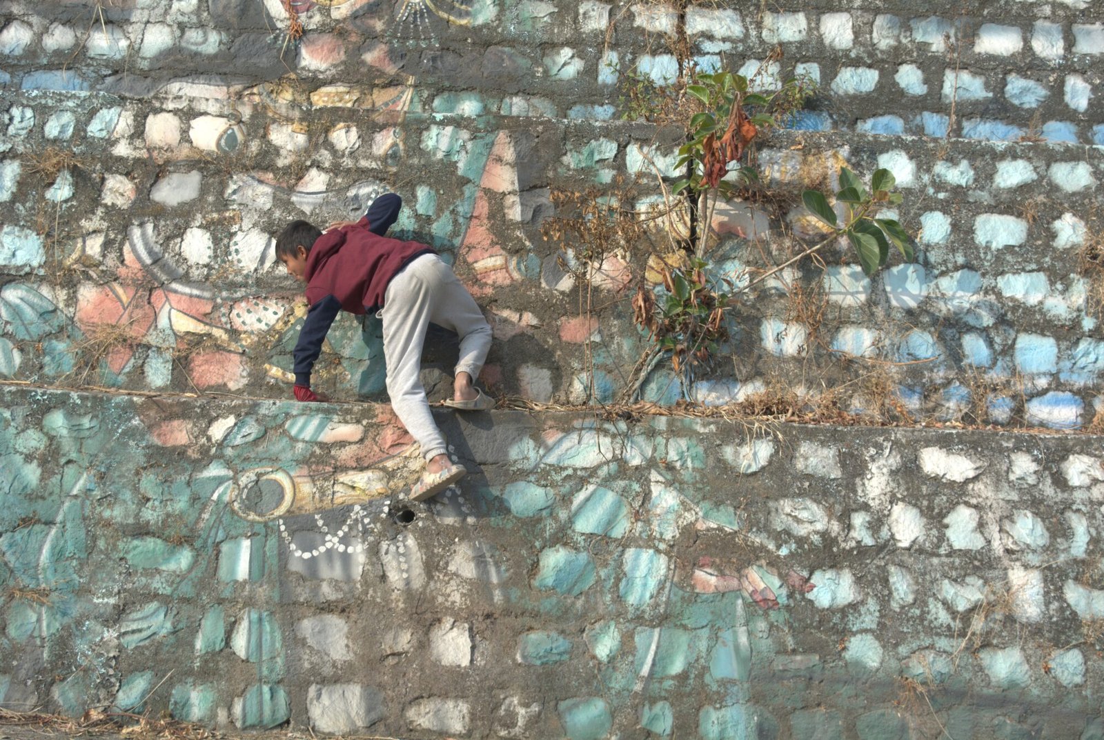 a kid climbing a wall