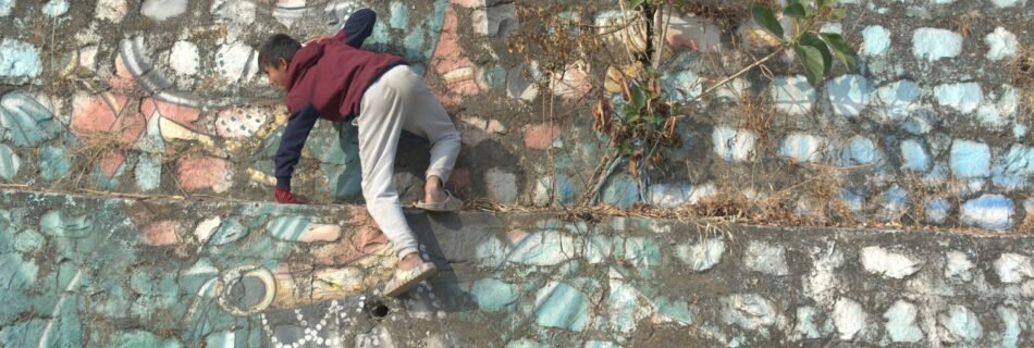 a kid climbing a wall